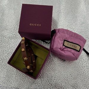 Gucci lion head.  Wear doubled as bracelet or as choker